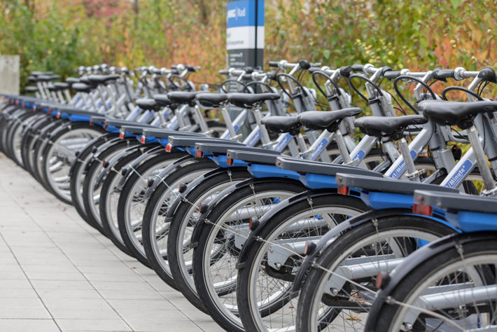 E-bikes parked in front of a metro station in Munich (photo by Chris Redan, Shutterstock.co)